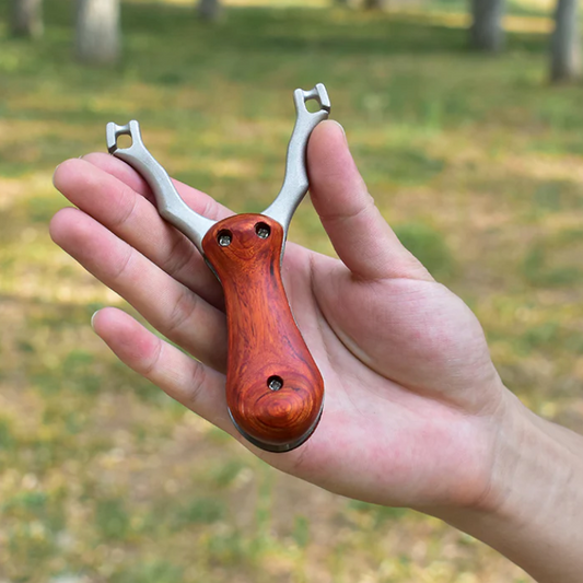 Tirachinas profesional plegable de acero inoxidable con mango de madera – ultra portátil para caza y supervivencia
